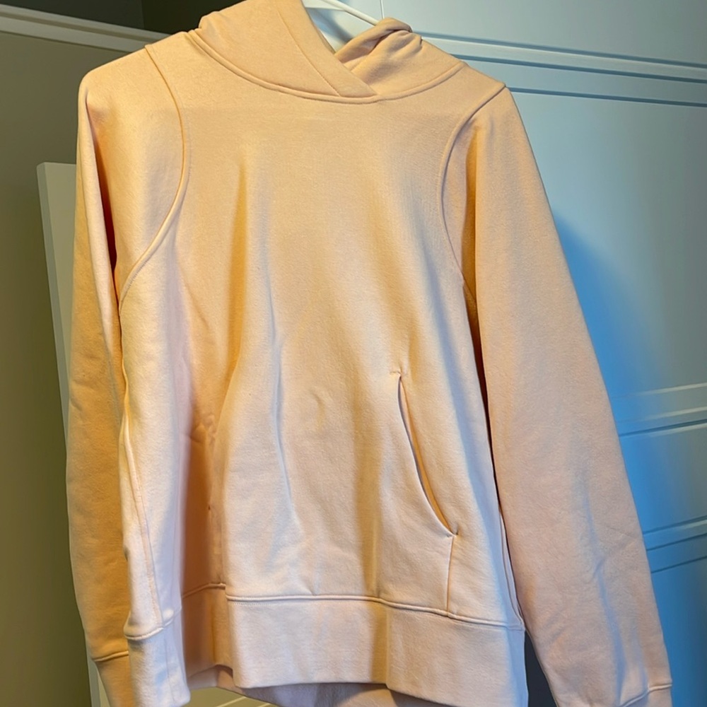 Peach colored lululemon sweatshirt